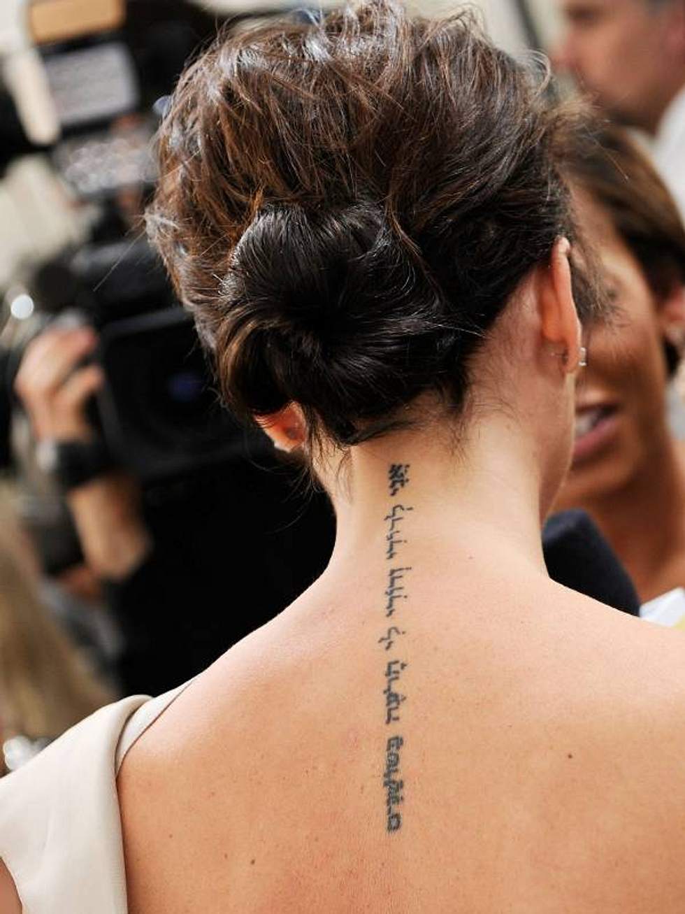 Татуировка Виктории Бекхэм на спине