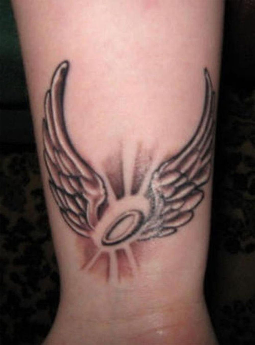 Angel wing tattoos for females on wrist
