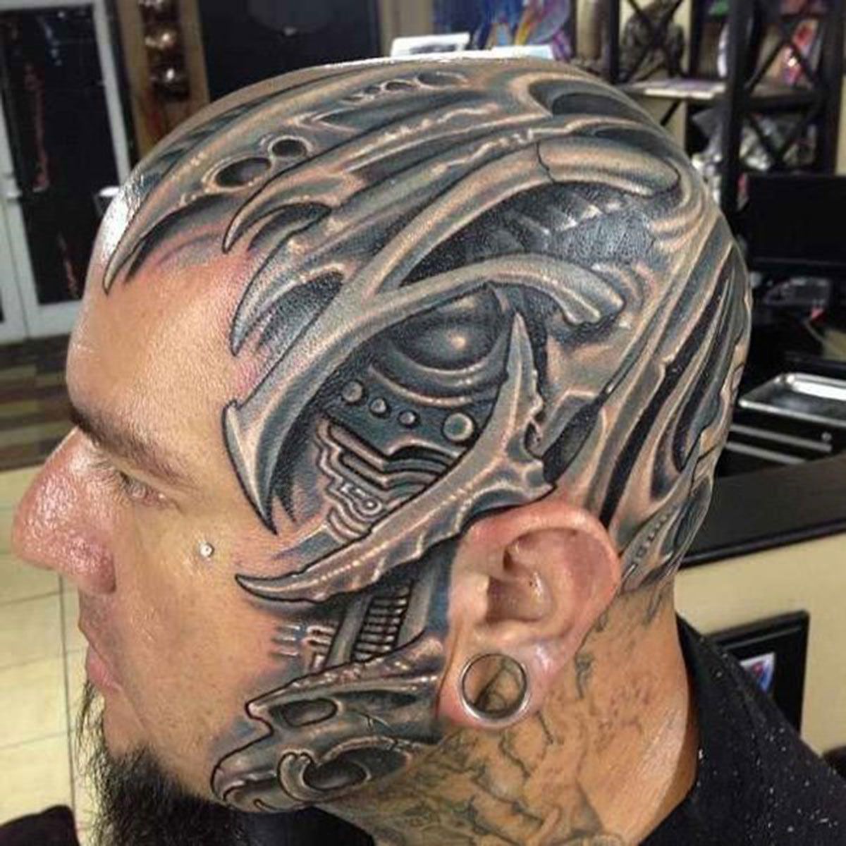 Biomechanical head tattoo