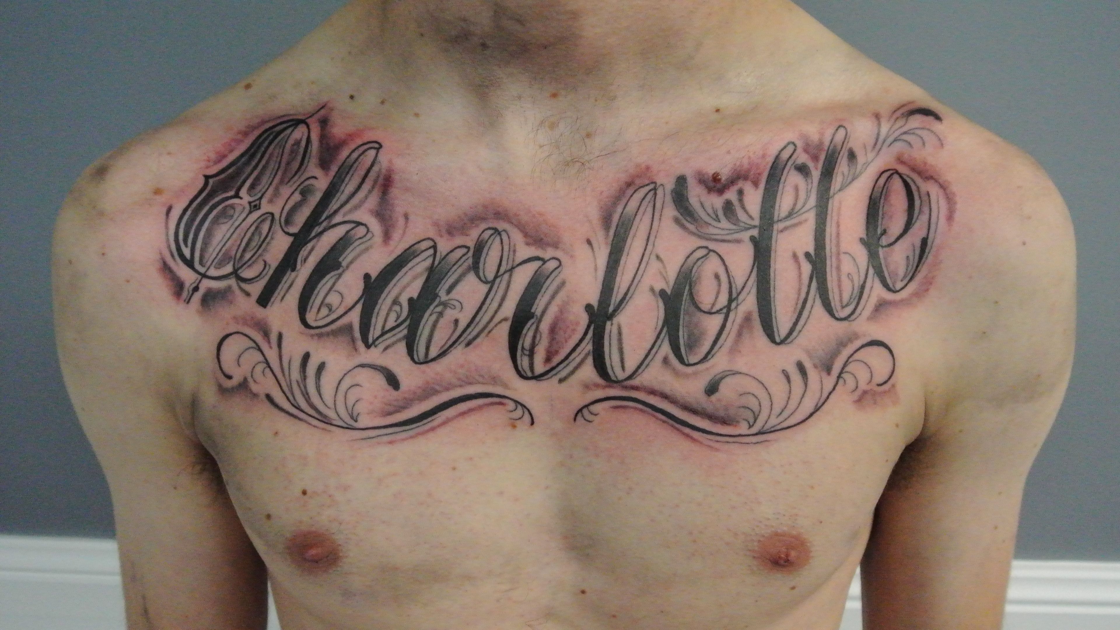 татуировки для мужчин на грудь надписи фото 105