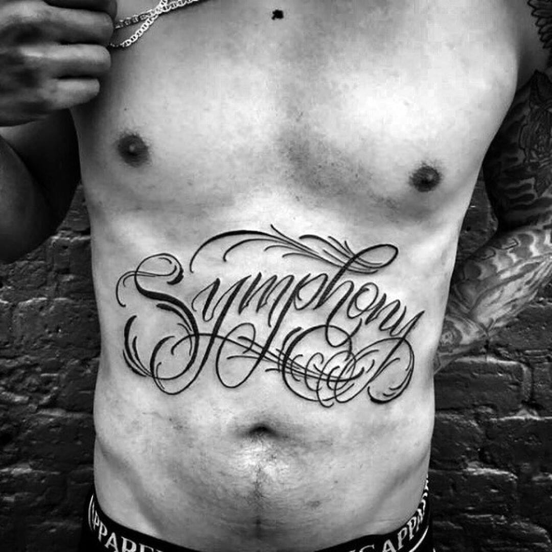 татуировки для мужчин на грудь надписи фото 112
