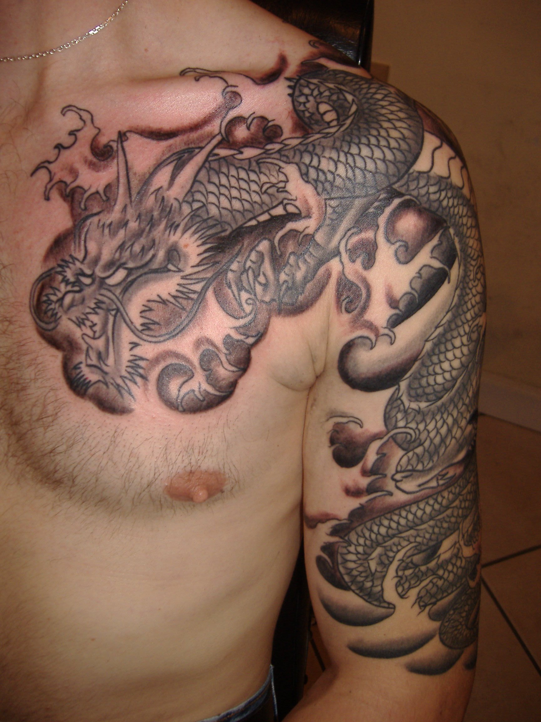 татуировки для мужчин драконы на груди фото 47