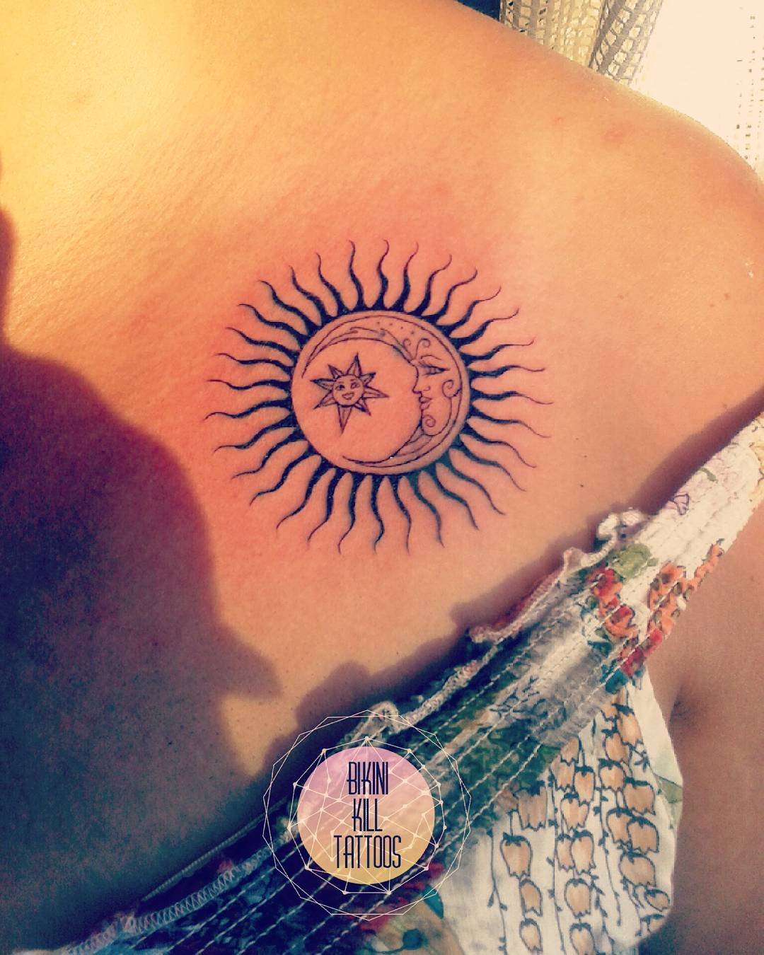 Этническое солнце тату