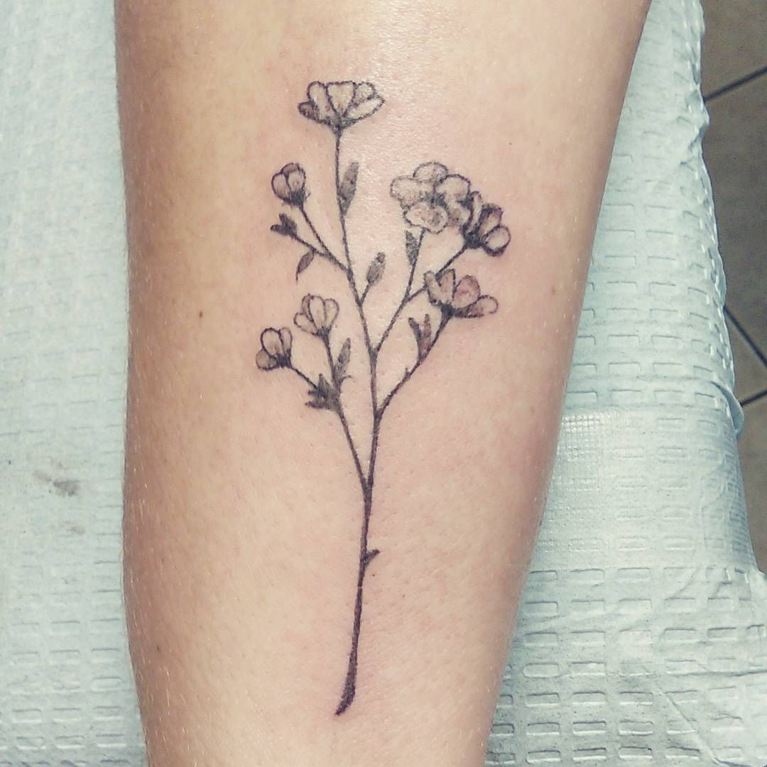 Flower plant wrist tattoo
