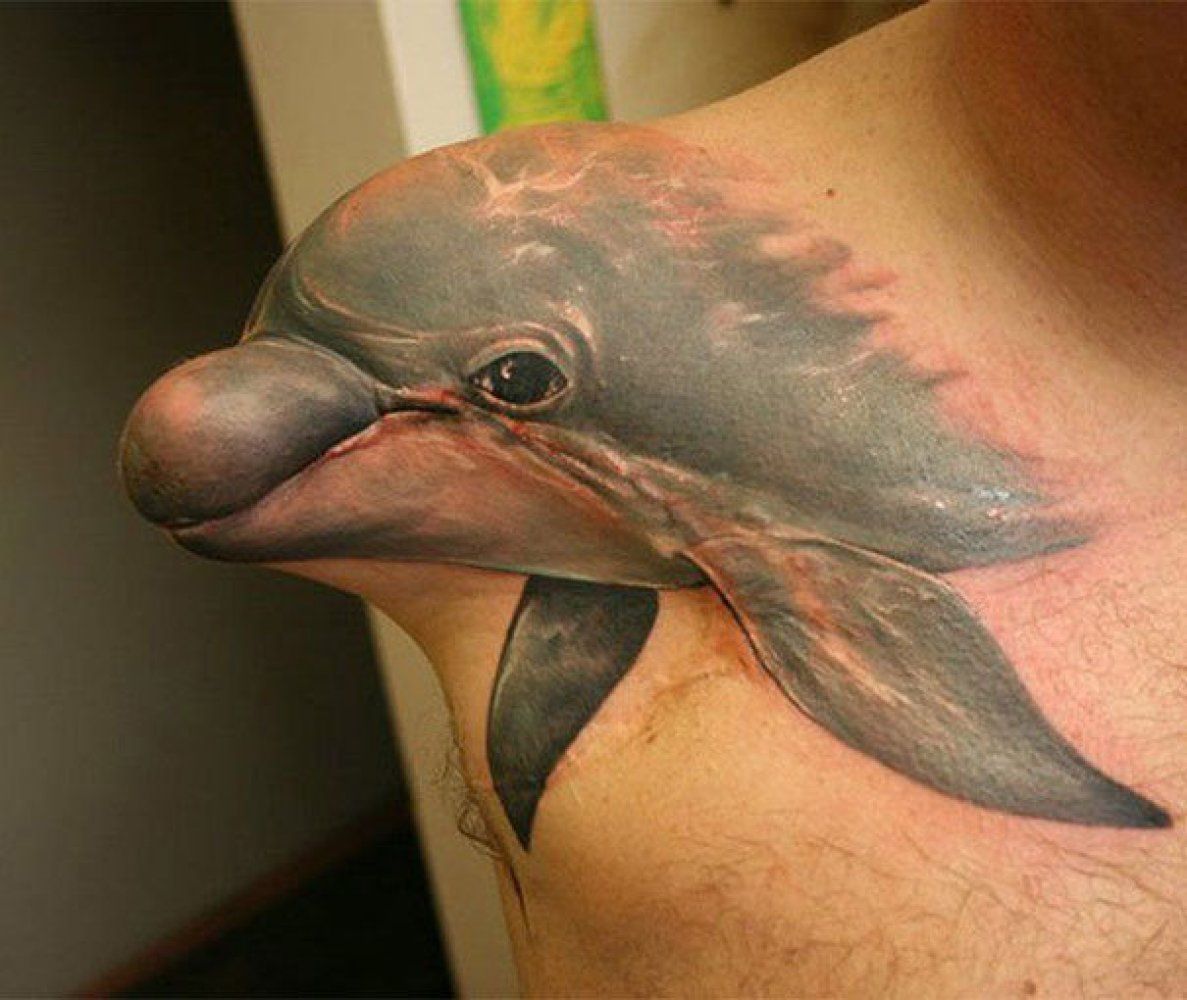 что означает татуировка дельфин у мужчины
