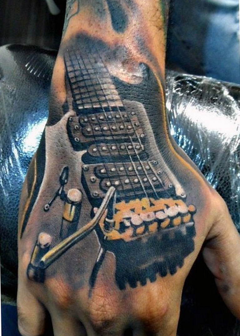 3d guitar tattoo on hand